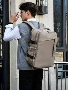 Detail of light grey waterproof backpack with side buckles and ergonomic back padding system
