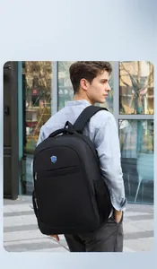 Side view of black Oxford cloth business backpack with padded straps and mesh side pocket