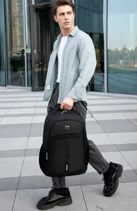 Front view of black business backpack with dual vertical stripes and ergonomic top handle