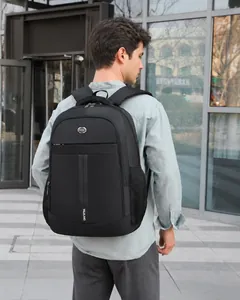 Detail shot of a black waterproof business laptop backpack worn in an urban outdoor setting