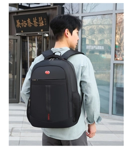 Rear view of black multi-functional laptop backpack with side mesh pocket and sport logo