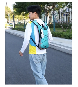 Close-up of ergonomic straps and bungee system on this blue outdoor hydration backpack