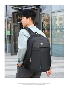 Side view of a black business laptop backpack with ergonomic padded shoulder straps