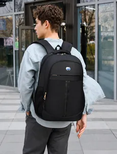 Modern black business backpack featuring ergonomic padded handle and waterproof texture detail