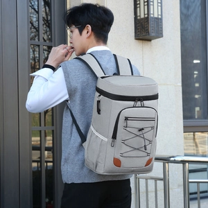 Light gray large thermal backpack cooler for outdoor picnics with adjustable elastic cords
