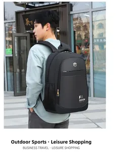 Side view of black business Oxford cloth backpack showing large capacity on city street