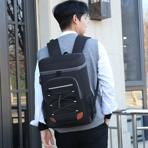 Insulated backpack cooler in black with grey zippers for outdoor picnics and travel
