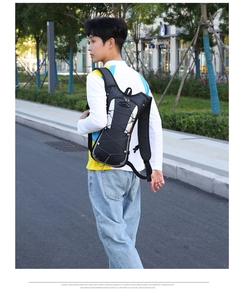 Outdoor cycling water bag backpack showing cross elastic drawstring and nylon texture