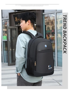 Detail view of large black Oxford fabric business laptop backpack on male model