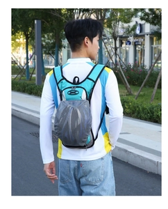 Outdoor sports backpack with breathable mesh compartment holding a cycling helmet securely