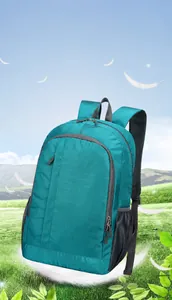 Detail of lightweight teal sports backpack with tear-resistant nylon texture and logo area
