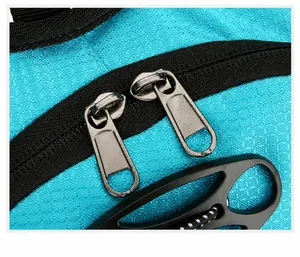 Detail of durable two-way metal zippers on blue outdoor hydration cycling backpack