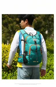 Outdoor cycling backpack in teal nylon with orange zippers and ergonomic waist strap