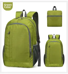 Detailed view of lightweight green folding sports backpack with grey straps and mesh pockets