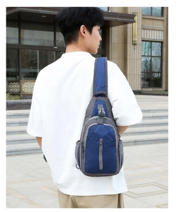 Detail view of water-resistant nylon sling bag showing side mesh pocket and buckle