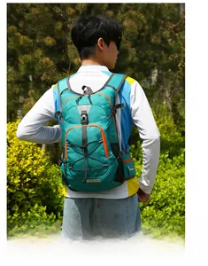Detailed view of lightweight peacock green nylon hiking backpack with orange zipper accents