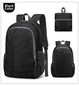 Detail view of black lightweight nylon sports backpack showing its foldable design