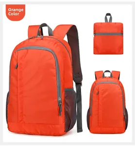 Detail view of foldable orange outdoor backpack made of lightweight tear-resistant fabric