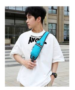 Waterproof blue shoulder bag featuring a functional headphone port and adjustable strap