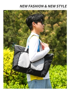 Détail du grand sac de voyage Vanaheimr montrant le tissu durable et la poche avant
