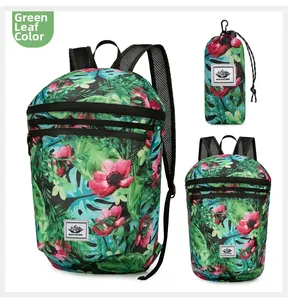 Detail view of foldable green leaves backpack with matching drawstring storage pouch
