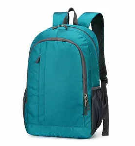 Detail view of water-resistant nylon fabric and mesh side pocket on turquoise sports backpack