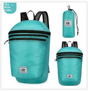 Detail of sky blue foldable backpack showing waterproof ripstop nylon and compact storage form