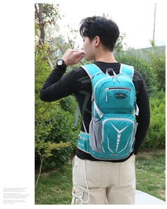 Ergonomic back system of a teal outdoor sports backpack with padded straps and waist support
