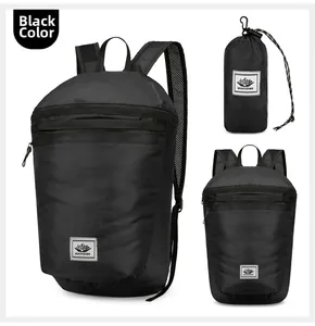 Detail view of foldable black backpack with breathable mesh straps and storage pouch