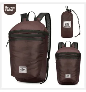 Macro detail of brown foldable backpack showing the lightweight nylon fabric and storage