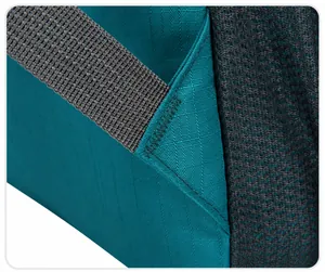 Detail of reinforced zig-zag stitching on high-density gray backpack straps for durability