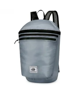 Detail view of water-resistant gray folding backpack with dual parallel front zippers