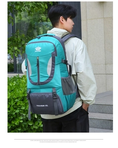 Waterproof 60L hiking backpack detail showing Vanaheimr logo and adjustable S-shaped straps