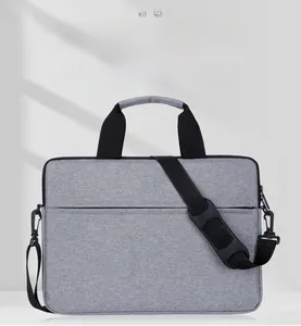 Grey laptop bag with scratch-resistant fabric and water-repellent multi-compartment design