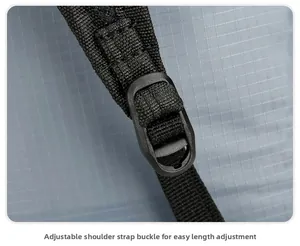Macro view of adjustable buckle and durable ripstop fabric on folding backpack strap