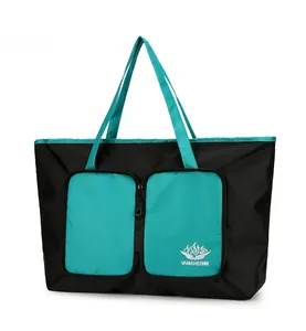 Détail du grand sac de voyage avec doubles poches zippées et poignées renforcées