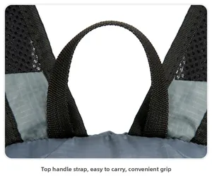 Detail of the reinforced black top handle webbing on the grey checkered outdoor backpack