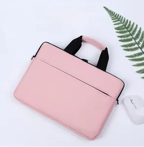 Pink waterproof laptop sleeve with black handles and front pocket featuring a sleek design
