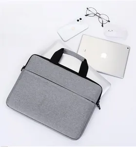 Detail showing high-capacity grey laptop bag interior with compartments for iPad and phone