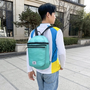 Lightweight water-resistant green outdoor backpack for hiking and travel activities