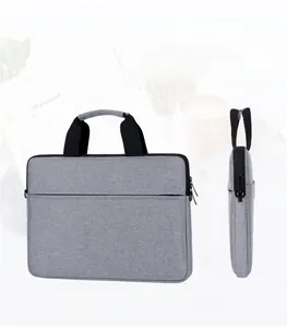 Slim grey fabric laptop sleeve featuring a hidden zipper pocket and integrated handle