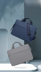 Detail showing high-capacity laptop bags with reinforced handles and adjustable straps