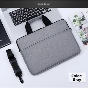 Close-up of a grey waterproof oxford briefcase with a black detachable shoulder strap