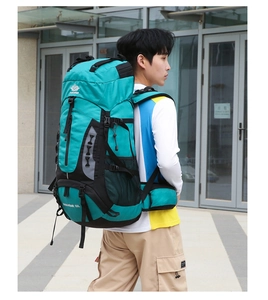 Detail of 60L outdoor hiking backpack in teal and black featuring durable waist straps