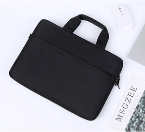 Close-up of black nylon laptop sleeve with hidden zipper pocket and reinforced top handle