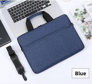 Blue waterproof oxford laptop bag with padded handles and adjustable shoulder strap