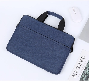 Close-up of blue Oxford fabric laptop bag with black handles and front zipper pocket