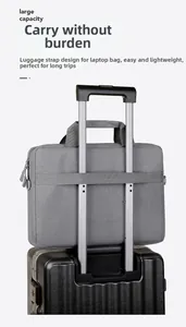 Detail of grey business laptop bag featuring a trolley sleeve for suitcase attachment