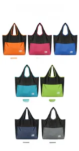Multiple colorful folding travel tote bags displayed in blue, orange, and rose pink colors