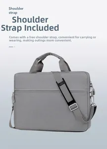 Detail of gray business laptop bag with reinforced handles and removable shoulder strap